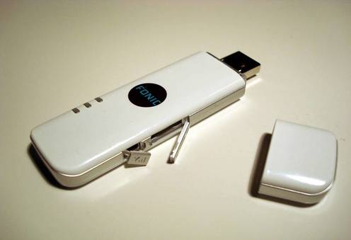 Huawei E160 with opened lids covering microSD slot and antenna connector
